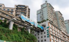 Train arriving at station within a residential building