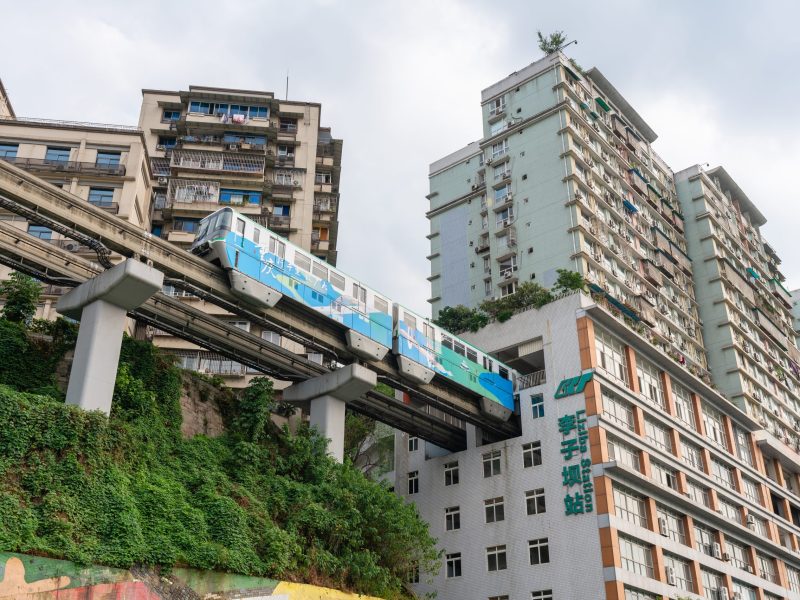 Train arriving at station within a residential building